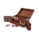 A MAHOGANY GAMES BOX INCLUDING IVORY CHESS SET ETC.