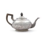 A GEORGE III IRISH SILVER TEAPOT, Dublin 1805, mark of Richard Sawyer, of circular form, the demi-