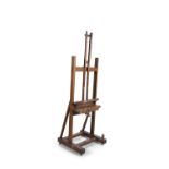 AN EDWARDIAN OAK FRAMED ARTIST'S EASEL, of 'h-shape' construction with adjustable rack, winding