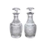 A PAIR OF 19TH CENTURY MALLET SHAPED DECANTERS with hobnail cut decoration, each 23cm high
