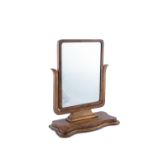 A VICTORIAN MAHOGANY FRAMED TOILET MIRROR, C. 1860, the articulate rectangular frame within crutch