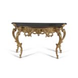 A CONTINENTAL GILT AND MIRROR TOP CONSOLE TABLE, of serpentine outline, on scrollwork supports.