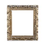A LARGE GILTWOOD AND GESSO FLORENTINE PICTURE FRAME, with two borders of foliate carving, the