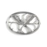 A SILVER BROOCH BY GEORG JENSEN, the oval-shaped brooch representing a Paradise bird in flight, with