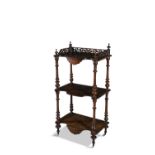 A WALNUT THREE TIER DUMB WAITER, c.1870, of rectangular form, with pierced three quarter gallery and