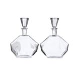 A PAIR OF ART DECO CLEAR GLASS DECANTERS AND STOPPERS, c.1930s; together with three moulded