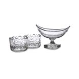 A PAIR OF CUT GLASS RINSERS, each 11.5cm wide and a navette shaped fruit bowl on foot, 23cm wide