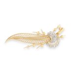 A DIAMOND SPRAY BROOCH, CIRCA 1950, of foliate design, the stylised elongated leaf with beading