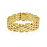 A GOLD BRACELET The highly articulated openwork brick-link bracelet, in 18K gold, length 17cm
