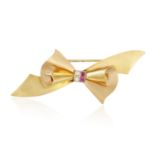 A MID 20TH CENTURY BOW BROOCH, BY TIFFANY & CO., CIRCA 1950 Designed as a bicoloured stylised bow