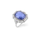 AN EARLY 20TH CENTURY SAPPHIRE AND DIAMOND RING The cushion-shaped sapphire weighing approximately