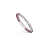 A RUBY AND DIAMOND ETERNITY RING The continuous row of circular-cut rubies, accented by a trio of