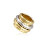 A GOLD RING, BY POMELLATO The wide polished concave band with two central rotating three-quarter