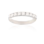 A DIAMOND HALF ETERNITY RING Set to the front with a row of brilliant-cut diamonds within claw-