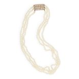 A NATURAL PEARL NECKLACE Composed of three rows of natural pearls, the cream tint pearls measuring