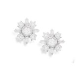 A PAIR OF DIAMOND CLUSTER EARRINGS Each brilliant-cut diamond at the centre accented by brilliant