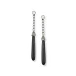 A PAIR OF LATE 19TH CENTURY ONYX AND DIAMOND PENDENT EARRINGS Each elongated onyx drop highlighted