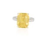 A COLOURED SAPPHIRE AND DIAMOND DRESS RING The cut-cornered rectangular-cut yellow sapphire weighing