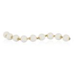 A PORCELAIN 'CHANDRA' BRACELET, BY BULGARI, CIRCA 1995 The uniform series of white porcelain beads