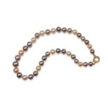 A MULTI-COLOURED CULTURED PEARL NECKLACE The single-strand of graduated round cultured pearls of