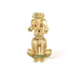 A GEM-SET AND GOLD NOVELTY BROOCH, CIRCA 1960 Modelled as a stylised dog, the eyes and nose set with