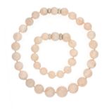 AN ANGEL-SKIN CORAL BEAD NECKLACE AND BRACELET The necklace composed of graduating coral bead