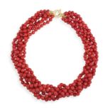 A CORAL BEAD NECKLACE Composed of a six-strand slightly graduated coral corallium rubrum beads