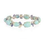 A GEM-SET AND DIAMOND BRACELET Composed of a line of graduated oval shaped turquoise cabochons,