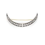 A DIAMOND CRESCENT BROOCH Set throughout with brilliant-cut diamonds, mounted in silver and gold,