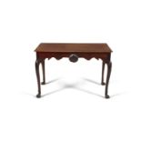 AN IRISH GEORGE III RECTANGULAR SIDE TABLE, the moulded top above carved apron with central scallop,