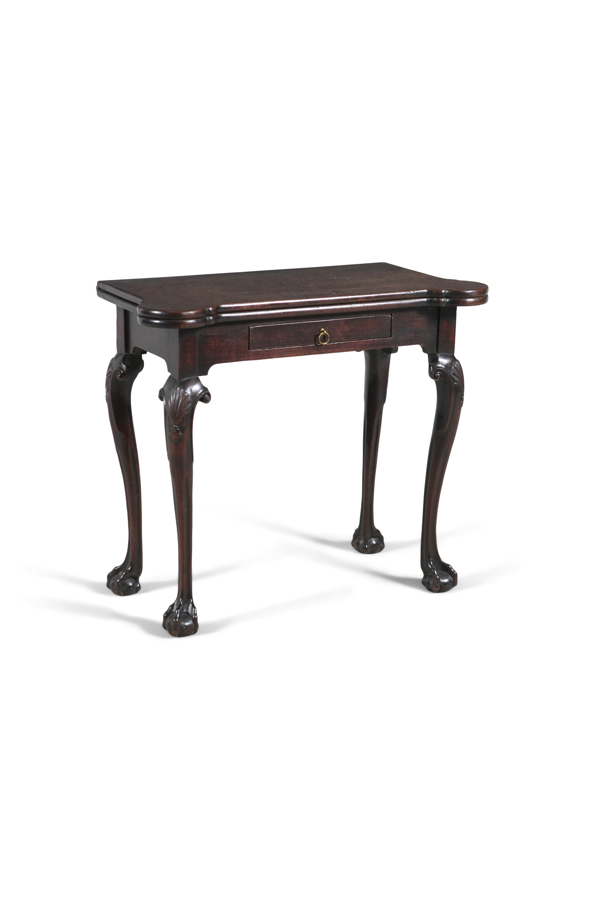AN IRISH GEORGE III MAHOGANY FOLDING TOP TEA TABLE, with rounded candle stands, with single frieze