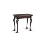 AN IRISH GEORGE III MAHOGANY FOLDING TOP TEA TABLE, with rounded candle stands, with single frieze