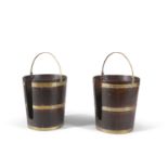 A PAIR OF IRISH GEORGE III MAHOGANY AND BRASS BOUND PLATE BUCKETS, of tapering circular form with