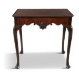 AN IRISH MAHOGANY TEA TABLE, the rectangular dish top above deep shaped aprons centred by shells, on