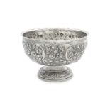 AN IRISH EDWARDIAN SILVER CIRCULAR ROSE BOWL, Dublin 1903, with flared wavy rim, the body chased