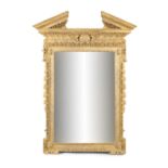A GEORGE III STYLE GILTWOOD MIRROR, in the manner of William Kent, with broken pediment above a leaf