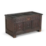 A LATE 17TH CENTURY OAK RECTANGULAR COFFER, the hinged lid with three fielded panels, above a