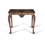 A GEORGE III MAHOGANY RECTANGULAR SILVER TABLE, raised on carved cabriole legs with leaf carved