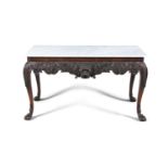 A CARVED MAHOGANY AND MARBLE TOP SIDE TABLE, of rectangular form, the mottled stone top above a