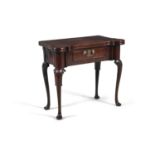 A GEORGE III MAHOGANY SHAPED RECTANGULAR FOLDING TOP GAMES TABLE, the top opening to reveal an