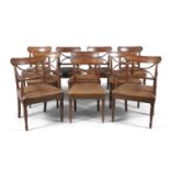 A SET OF TEN IRISH GEORGE IV MAHOGANY RAIL BACK DINING CHAIRS, each with curved panel back and cross