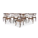 A SET OF TEN REGENCY INLAID MAHOGANY CURVED RAIL BACK DINING CHAIRS, inset with brass foliate