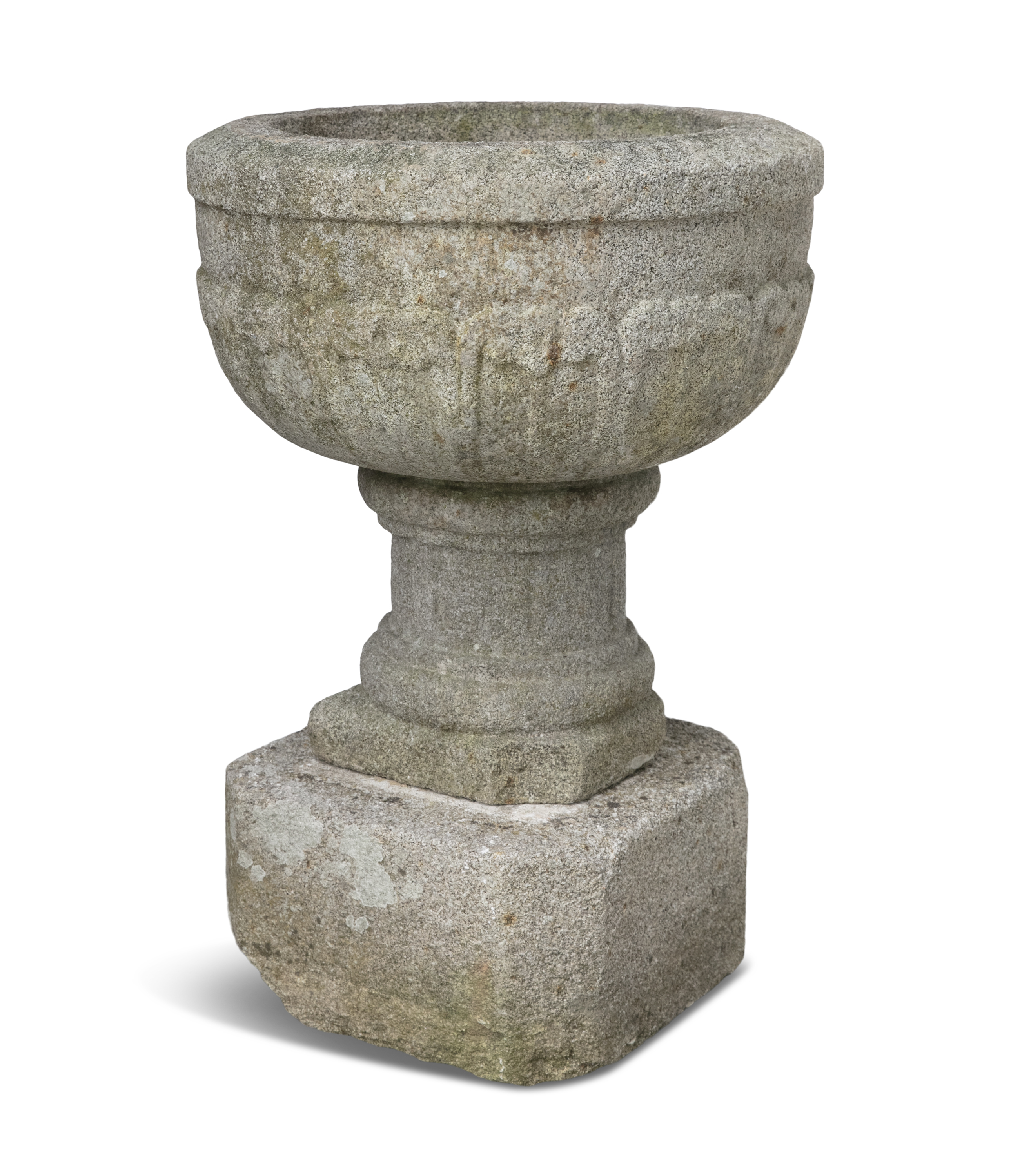 A LARGE EARLY VICTORIAN GRANITE WATER FONT, of deep circular form, the exterior carved with a band