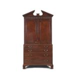 A GEORGE III MAHOGANY SECRETAIRE CABINET, the architectural top with broken triangular pediment