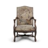 A GEORGE III MAHOGANY OPEN ARMCHAIR, with close-nailed tapestry upholstery, the arms finely carved