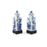A PAIR OF CHINESE BLUE AND WHITE PORCELAIN SQUARE BOTTLE VASES AND COVERS, Kangxi (1654-1722),