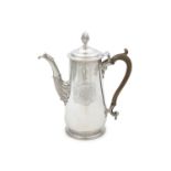 AN IRISH GEORGE I SILVER COFFEE POT, by George Hill, Dublin c.1715, of tapering cylindrical form,