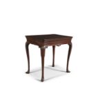 AN 18TH CENTURY RED WALNUT TABLE, of rectangular form, with cavetto top, invested corners above a