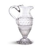A HANDSOME CUT-GLASS CLARET JUG, probably Irish, c. 1800, the facetted neck above a deep bowl of