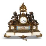 A FRENCH 19TH CENTURY BRONZE AND GILT BRASS MANTLE CLOCK, the white enamel drum dial signed